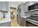 Kitchen featuring stainless steel refrigerator and view into the adjacent dining area at 2960 59Th S St # 303, Gulfport, FL 33707