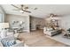 Open living room with ceiling fan, desk, sofa, and chairs at 2960 59Th S St # 303, Gulfport, FL 33707