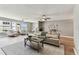 Bright living room with comfortable seating, ceiling fan, and work desk at 2960 59Th S St # 303, Gulfport, FL 33707