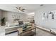 Spacious living room featuring a ceiling fan and stylish décor at 2960 59Th S St # 303, Gulfport, FL 33707