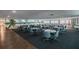 Bright meeting room featuring tables, chairs, and beach-themed mural on the wall at 2960 59Th S St # 303, Gulfport, FL 33707