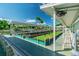 Well-maintained shuffleboard courts with shaded seating, perfect for recreational activities in the Town Shores community at 2960 59Th S St # 303, Gulfport, FL 33707