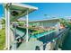 Covered shuffleboard courts at Town Shores offer shaded recreation for residents with bench seating at 2960 59Th S St # 303, Gulfport, FL 33707