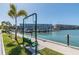 Scenic waterfront view with bench swing, seating, and boat marina, perfect for enjoying the outdoors at 2960 59Th S St # 303, Gulfport, FL 33707