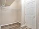 Spacious walk-in closet with wooden floor and ample shelving for storage at 30753 Pumpkin Ridge Dr, Wesley Chapel, FL 33543