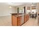 Open-concept kitchen with granite counters, stainless steel appliances, and adjacent dining area at 30753 Pumpkin Ridge Dr, Wesley Chapel, FL 33543