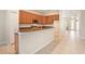 Modern kitchen with granite counters, stainless appliances, and an open layout to the entryway at 30753 Pumpkin Ridge Dr, Wesley Chapel, FL 33543