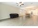 Spacious open floorplan shows the living room, dining area, and bright kitchen with tile floors at 31603 Magna Gulf Loop, San Antonio, FL 33576