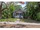 Charming single-story home with inviting porch and lush tropical landscaping at 317 19Th S Ave, St Petersburg, FL 33705