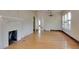 Bright living room with hardwood floors, a fireplace, and several windows at 317 19Th S Ave, St Petersburg, FL 33705