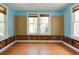 Spacious living room enhanced by natural light from windows and wood flooring for easy design upgrades at 317 19Th S Ave, St Petersburg, FL 33705