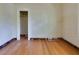 Living room with hardwood floors and doorway with missing baseboards gives potential for new owners at 317 19Th S Ave, St Petersburg, FL 33705
