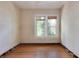 Bright living room featuring hardwood floors, a window with natural light, and walls ready for paint at 317 19Th S Ave, St Petersburg, FL 33705