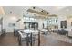 Spacious clubhouse featuring contemporary design, ample seating, and modern lighting fixtures at 33306 Castaway Loop, Wesley Chapel, FL 33543