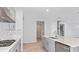 Bright kitchen featuring a central island, stainless steel appliances, and a modern gas cooktop at 33306 Castaway Loop, Wesley Chapel, FL 33543