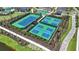 Aerial view of the tennis and pickleball courts in the community at 33306 Castaway Loop, Wesley Chapel, FL 33543