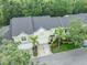 Aerial view of the townhome showing the well manicured lawn and new roof at 3415 Heards Ferry Dr, Tampa, FL 33618