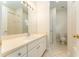 Spacious bathroom featuring a large mirror, tiled flooring, and great lighting at 3415 Heards Ferry Dr, Tampa, FL 33618