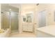 Bright bathroom featuring tiled floor, double vanity, and glass enclosed walk in shower at 3415 Heards Ferry Dr, Tampa, FL 33618
