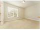 Bright bedroom with neutral carpet, a ceiling fan, and a large window with natural light at 3415 Heards Ferry Dr, Tampa, FL 33618