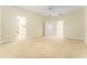 Expansive bedroom with multiple doorways, neutral carpet, and lots of open space at 3415 Heards Ferry Dr, Tampa, FL 33618
