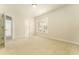 Bright bedroom with neutral carpet, a ceiling fan, and a large window with natural light at 3415 Heards Ferry Dr, Tampa, FL 33618