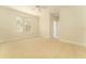 Bright, carpeted bedroom with ceiling fan, large window, and neutral paint at 3415 Heards Ferry Dr, Tampa, FL 33618