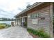 Exterior view of the Lakeside Preserve clubhouse featuring restrooms and a waterfront deck at 3415 Heards Ferry Dr, Tampa, FL 33618