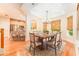 Well-lit dining room area featuring a decorative chandelier and a natural wood table at 3415 Heards Ferry Dr, Tampa, FL 33618