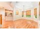Bright dining room with a chandelier and windows with woven shades at 3415 Heards Ferry Dr, Tampa, FL 33618