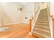 Spacious living room with hardwood floors, a ceiling fan, and a staircase to the second floor at 3415 Heards Ferry Dr, Tampa, FL 33618