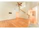 Bright living room featuring hardwood floors, vaulted ceilings and a ceiling fan at 3415 Heards Ferry Dr, Tampa, FL 33618
