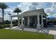Community amenity center with outdoor seating, pergola, artificial turf, and a convenient space for community gatherings at 34234 Polacca Ln, Wesley Chapel, FL 33543