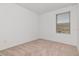 Bedroom with window offering natural light and neutral carpeting at 34234 Polacca Ln, Wesley Chapel, FL 33543