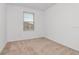 Bright bedroom with a window overlooking the neighborhood at 34234 Polacca Ln, Wesley Chapel, FL 33543