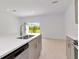 Bright kitchen with island and outdoor view at 34234 Polacca Ln, Wesley Chapel, FL 33543