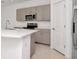 Kitchen featuring stainless steel appliances, island, and white countertops at 34234 Polacca Ln, Wesley Chapel, FL 33543