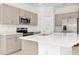 Well-lit kitchen featuring modern appliances and island at 34234 Polacca Ln, Wesley Chapel, FL 33543