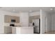 Bright kitchen with stainless steel appliances and island at 34234 Polacca Ln, Wesley Chapel, FL 33543
