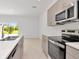 Modern kitchen featuring stainless steel appliances and white countertops at 34234 Polacca Ln, Wesley Chapel, FL 33543