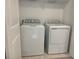 Convenient laundry area featuring a new, white washer and dryer, offering ease and efficiency for household chores at 34234 Polacca Ln, Wesley Chapel, FL 33543