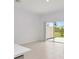 Open floor plan with bright living space and outdoor access at 34234 Polacca Ln, Wesley Chapel, FL 33543