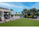 Community pool area with seating, pergola and green turf provides a recreational space at 34234 Polacca Ln, Wesley Chapel, FL 33543