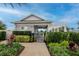 Inviting community pool area featuring a covered clubhouse, lush landscaping, and ample seating at 34234 Polacca Ln, Wesley Chapel, FL 33543