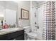 This bathroom features a shower/tub with gray and white chevron shower curtain at 3901 Silverlake Way, Wesley Chapel, FL 33544