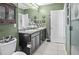 Spacious bathroom featuring dual sinks, granite countertop, and ample vanity storage at 3901 Silverlake Way, Wesley Chapel, FL 33544