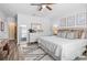 A comfortable bedroom features a large bed, dresser, and side tables at 3901 Silverlake Way, Wesley Chapel, FL 33544