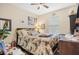 This cozy bedroom has a ceiling fan and a window with blinds at 3901 Silverlake Way, Wesley Chapel, FL 33544