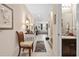 Inviting hallway with tile flooring leads to a cozy living room with natural light and access to the half bath at 3901 Silverlake Way, Wesley Chapel, FL 33544