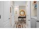Convenient hallway with laundry and access to other rooms of the house at 3901 Silverlake Way, Wesley Chapel, FL 33544